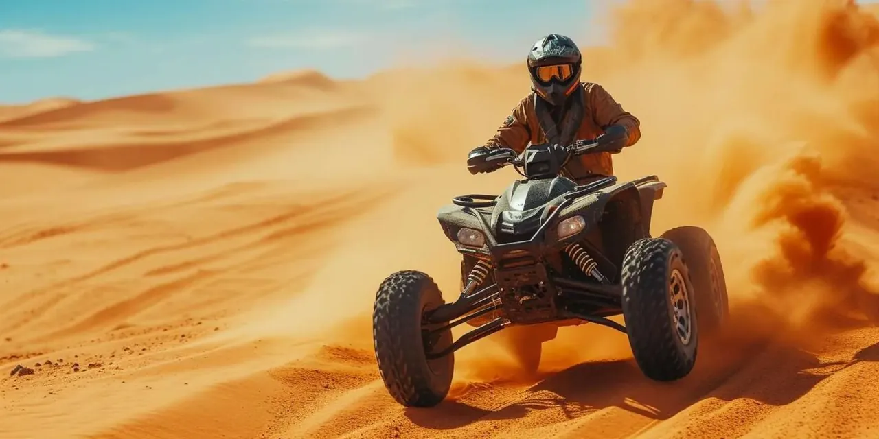 Quad bike kicking up sand on a desert ride outside Agadir