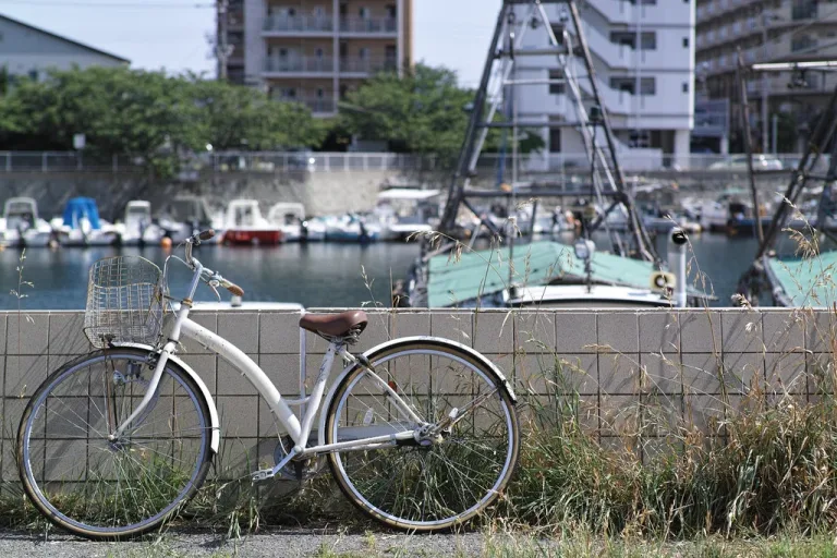 A city bicycle parked on the Agadir beachfront promenade with the Atlantic behind