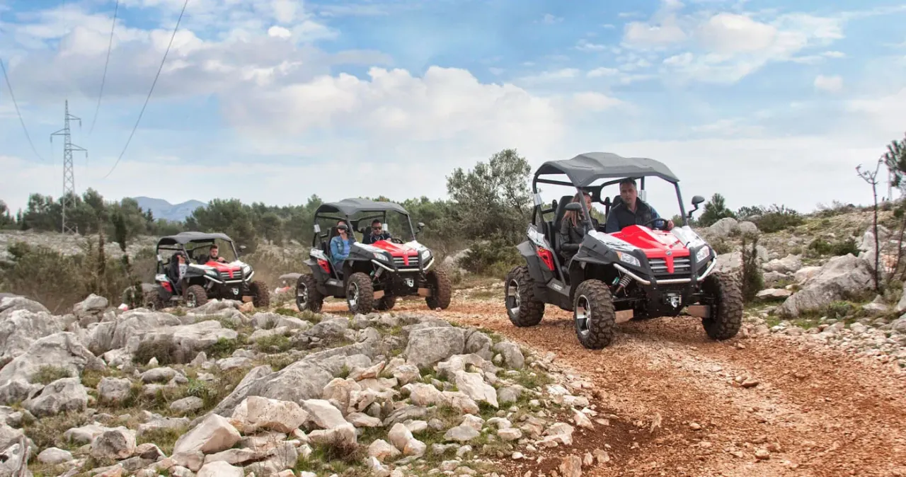 Buggy driving off-road through rocky desert scrub outside Agadir, Morocco