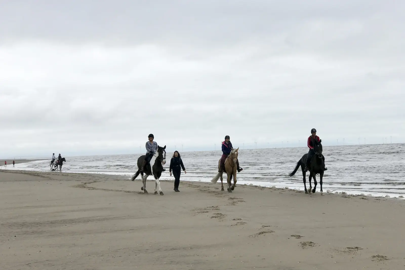 Horse rider on Agadir beach with the Atlantic Ocean behind