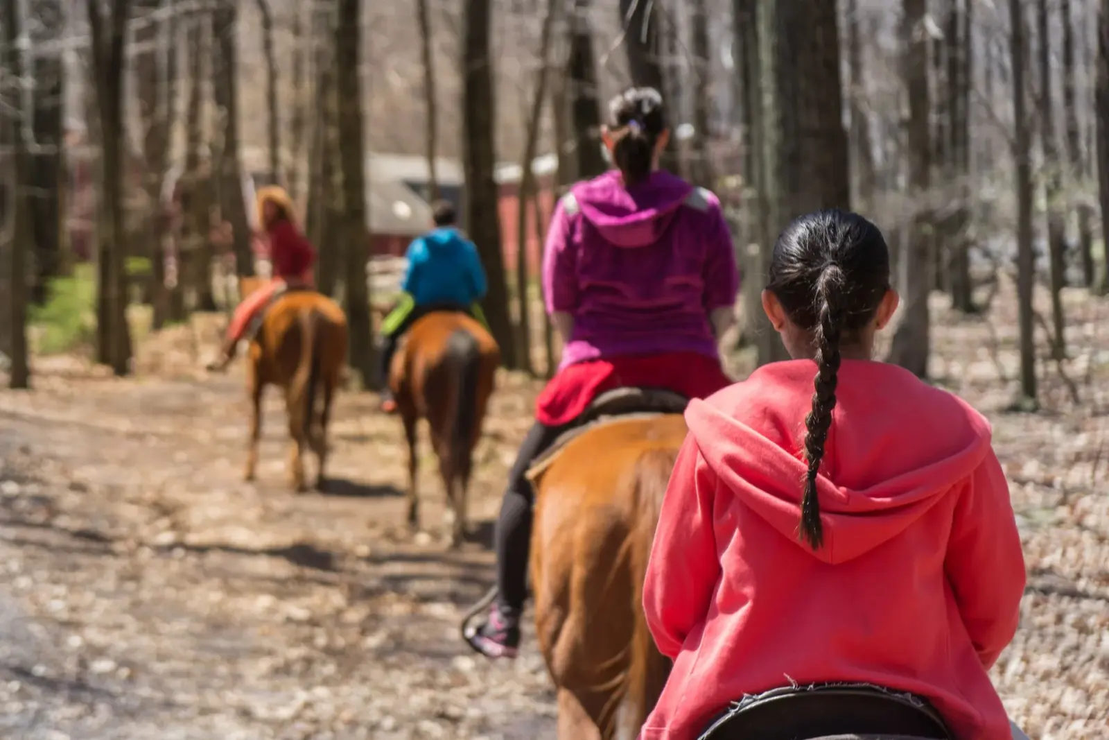 A line of riders on horseback following a sandy trail near Agadir