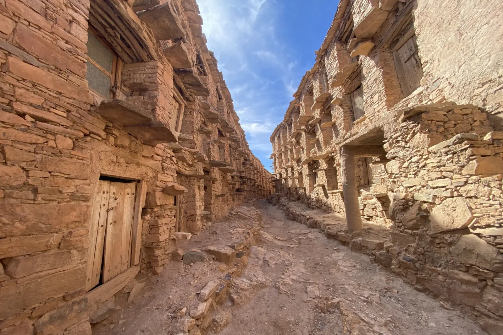 Wide view of Agadir Inoumar and its surrounding terraced landscape in the Anti-Atlas