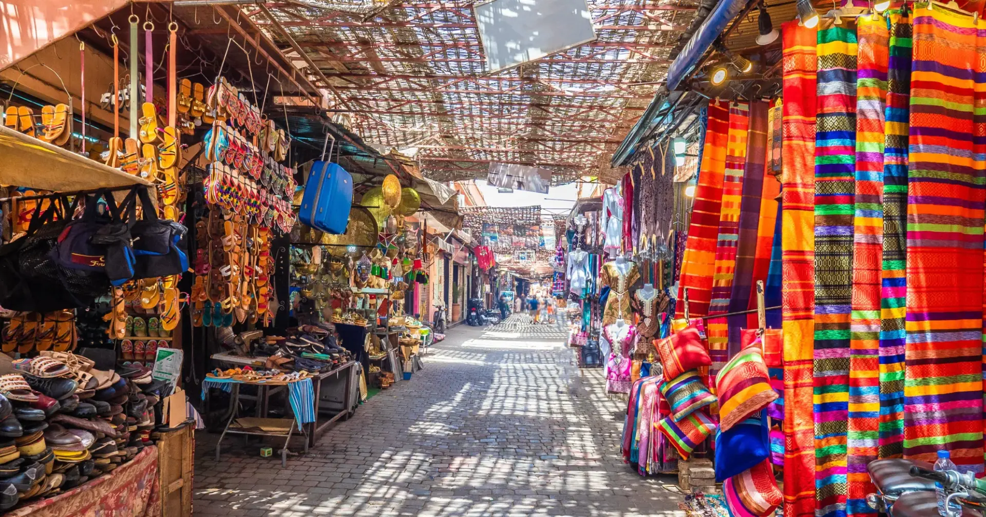 Colourful carpets and stalls in the alleys of Souk El Had, Agadir